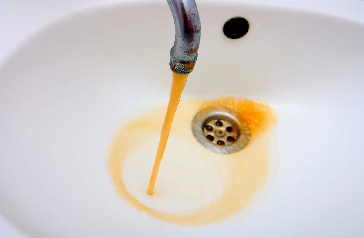 rusty water in sink - orange water stains
