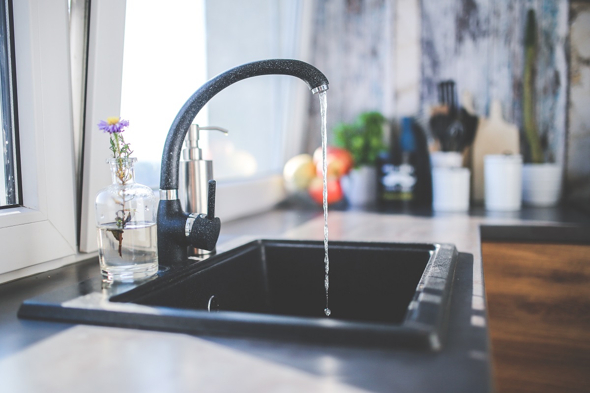 sink dripping water - water softener vs water filter